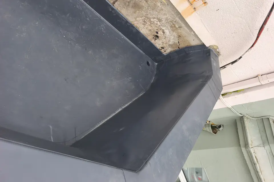 Corner of a newly lined box gutter