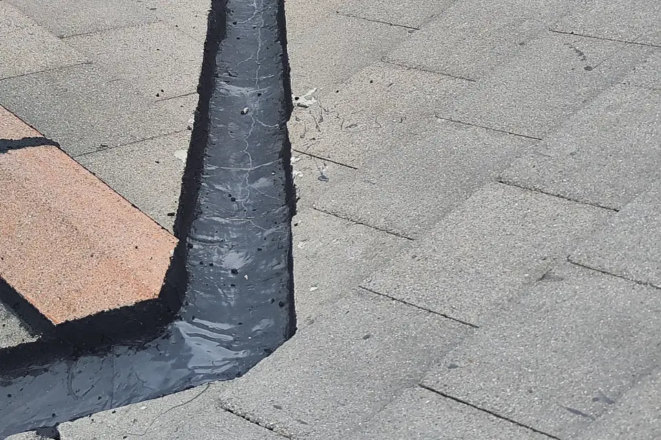 Flashing where a tiled extension roof meets the wall