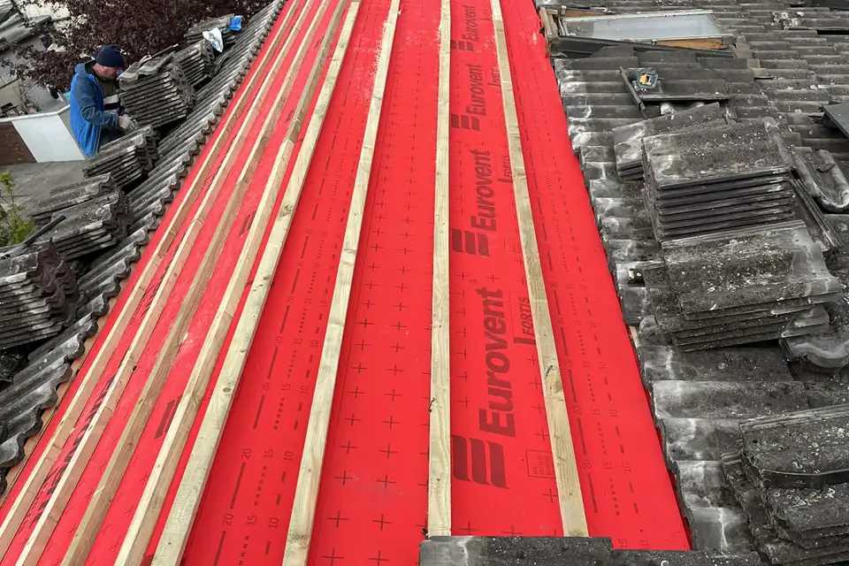 Breathable membrane and new battens on a roof being re-laid