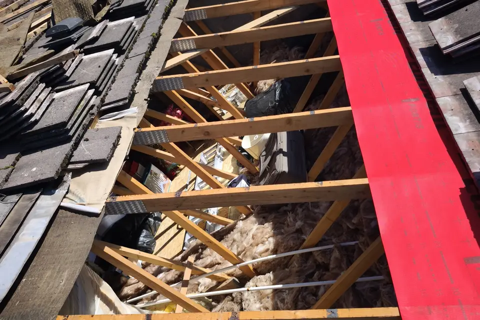Roof stripped to the rafters with new membrane going on